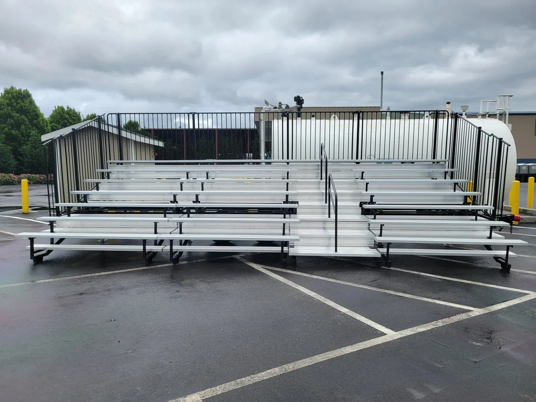 Portable event bleacher seating set up in a parking lot for an outdoor event