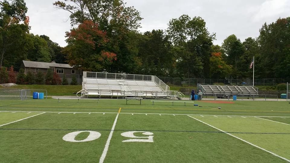 Bleachers set up on a football field available for rent from Bleachers NW LLC